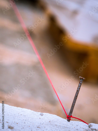 String used as level in the construction of wall.