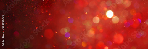 background of abstract red, gold and black glitter lights. defocused. banner © tomertu