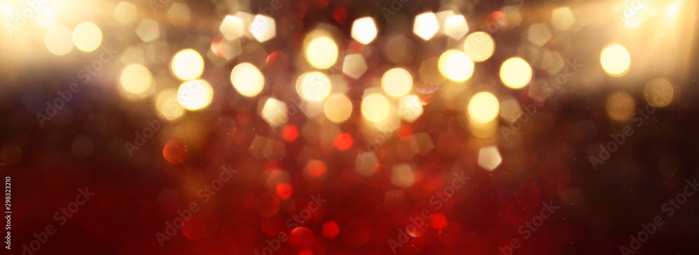 background of abstract red, gold and black glitter lights. defocused. banner