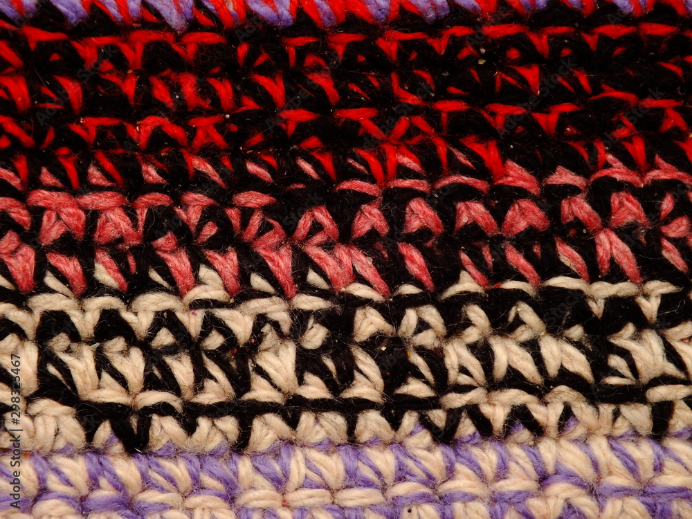 Fototapeta premium the texture of the knitted fabric is a thick multi-colored thread