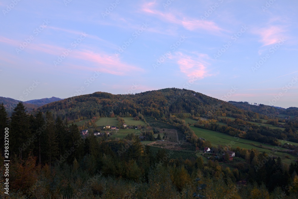 Landscape in autumn evening, blue hour. Bystrice, Beskydy mountains, Czech republic.