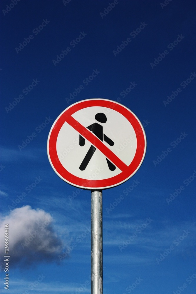 Road sign pedestrians are forbidden to pass with the sky Road sign pedestrians are forbidden to pass with the sky