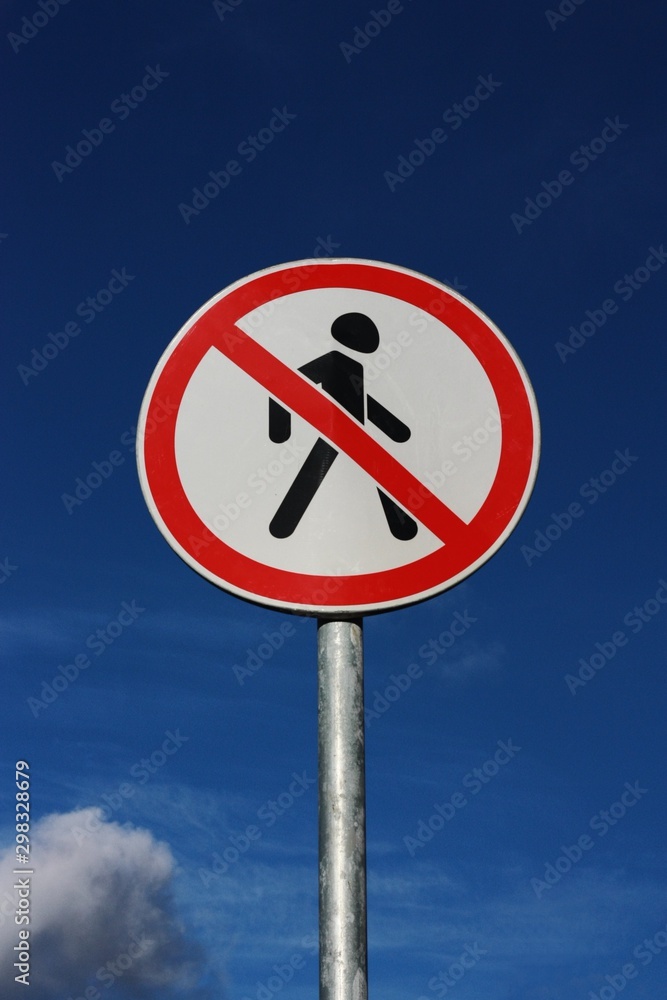 Road sign pedestrians are forbidden to pass with the sky Road sign pedestrians are forbidden to pass with the sky