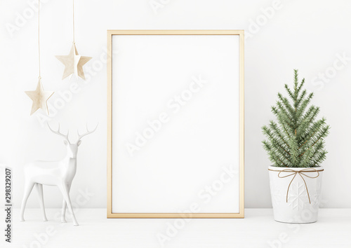 Vertical christmas poster mockup with golden frame, fir tree, star garland and deer on white wall background. 3D rendering, illustration.