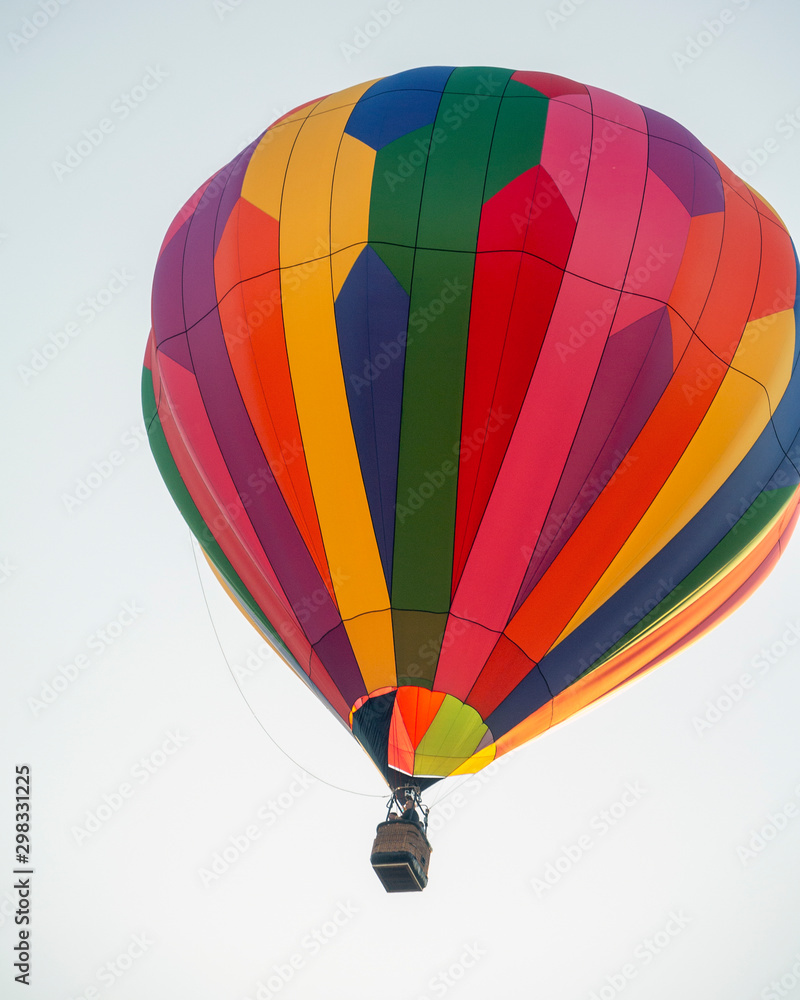 Fototapeta premium Rainbow Colored Balloon against Clear Sky