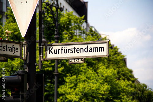 Photography A street sign showing the name of the famous avenue called Kurfürstendamm (also known as Ku'damm) in the Upper West of Berlin, Germany