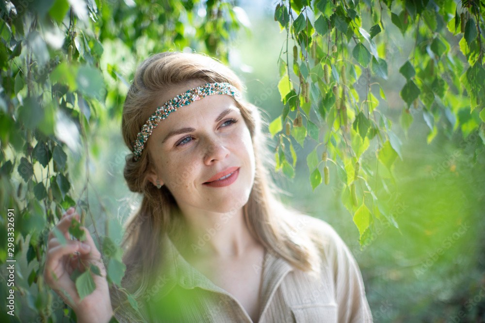 Beautiful woman. Green leaves. Portrait. Beautiful woman. Green leaves. Portrait.