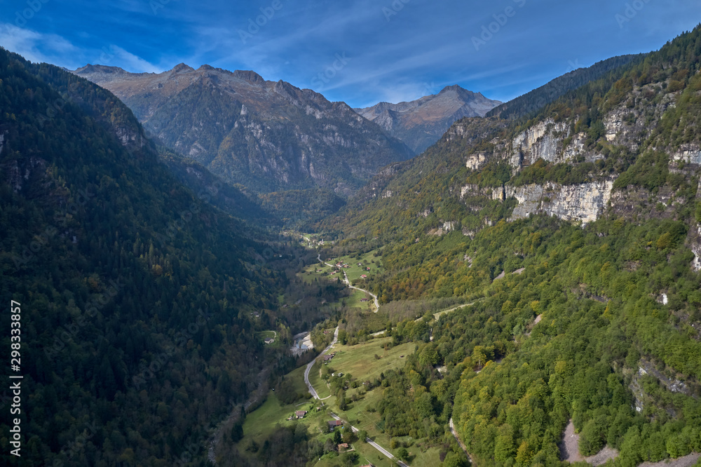 Autumn season, red-yellow trees. Aerial photography. Panoramic view of the Alps north of Italy. Trento Region. Great trip to the Alps.