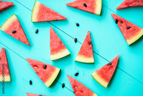 Watermelon slice on a blue rustic wood background