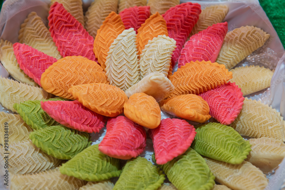 National Azerbaijan sweet pastry Colorfull shekerbura with nuts and honey on wooden table background, close up. Delicious dessert Colorfull Shekerbura baked during the spring holiday Novruz. National Azerbaijan sweet pastry Colorfull shekerbura with nuts and honey on wooden table background, close up. Delicious dessert Colorfull Shekerbura baked during the spring holiday Novruz.