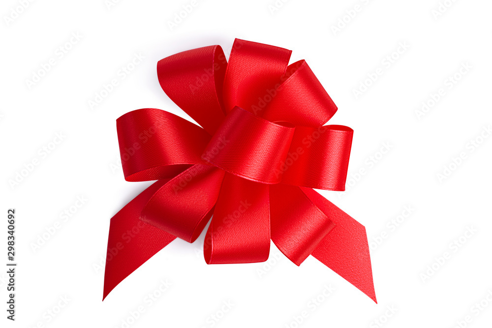 Flat lay big beautiful red ornate festive gift unusual bow with many petal loops made by hand from a red satin shiny ribbon isolated on white background