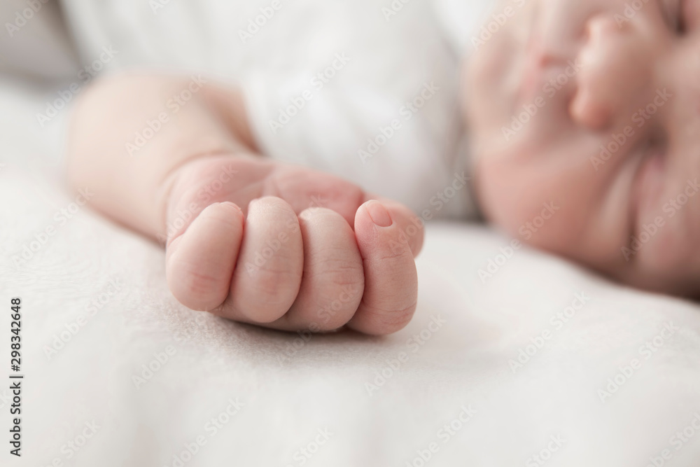 Little hand of sleeping male newborn, close-up Little hand of sleeping male newborn, close-up