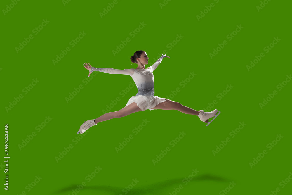 Figure skating girl isolated on green background.