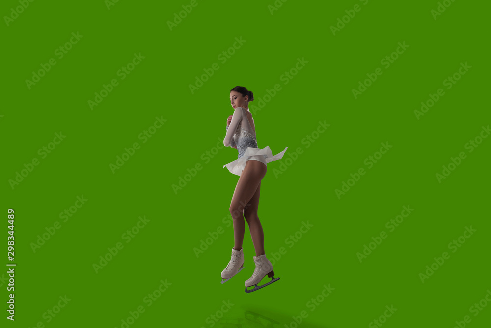 Figure skating girl isolated on green background. Figure skating girl isolated on green background.