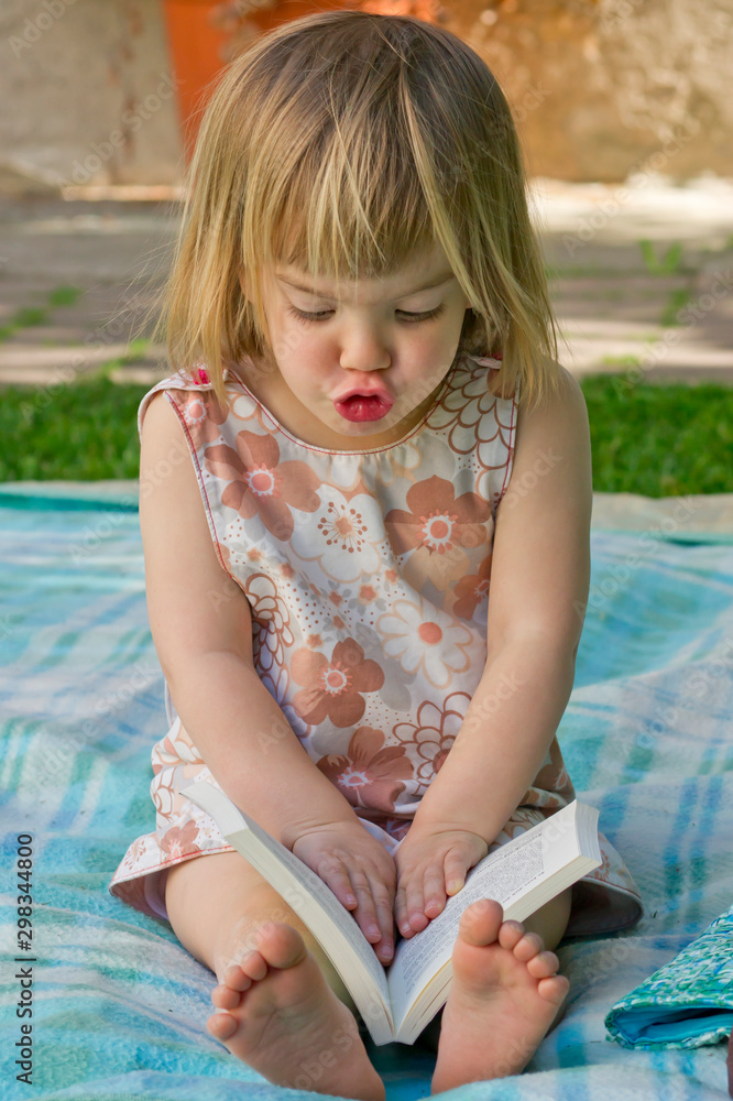 Germany, Baden Wuerttemberg, Girl reading book Germany, Baden Wuerttemberg, Girl reading book