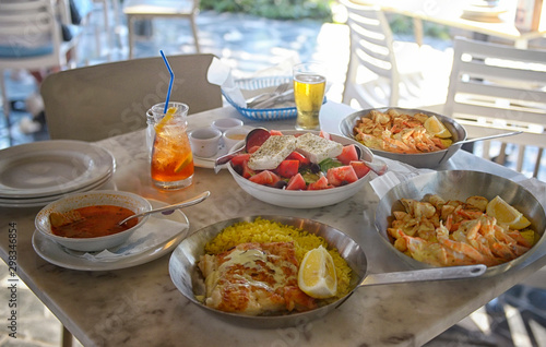 A summer  dinner .Unidentified people eating traditional delicious mediterranean dish  outdoor restaurant  in Cyprus   Ayia-napa.Tasty and authentic cypriot kitchen