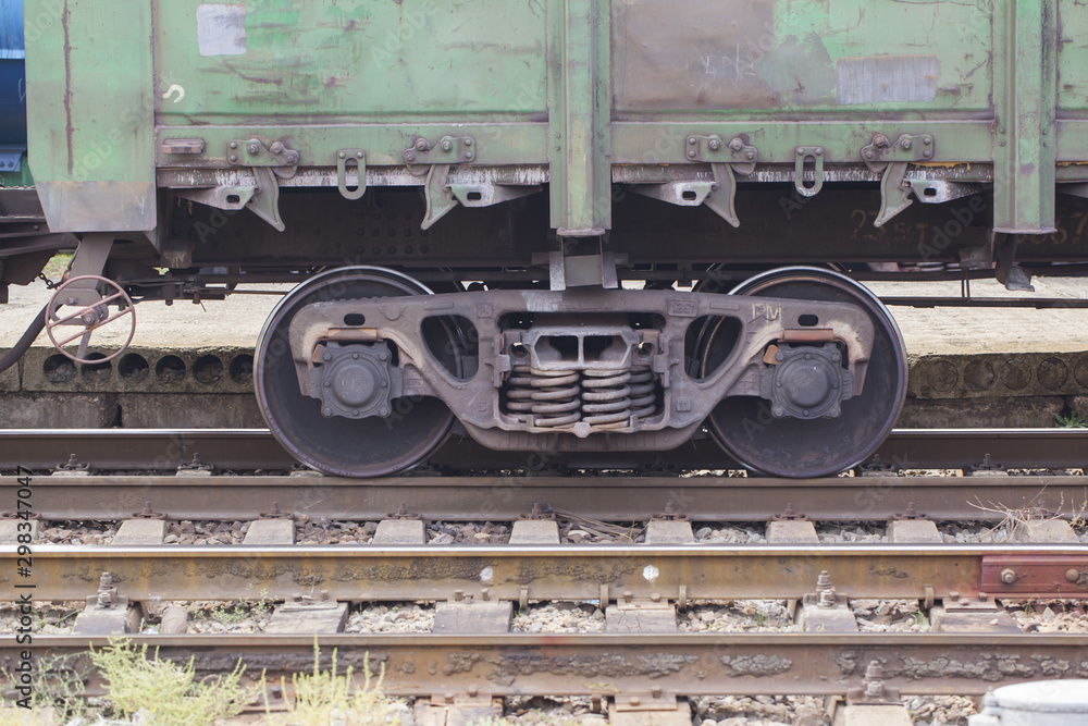 A pair of wheels of a freight train close up A pair of wheels of a freight train close up