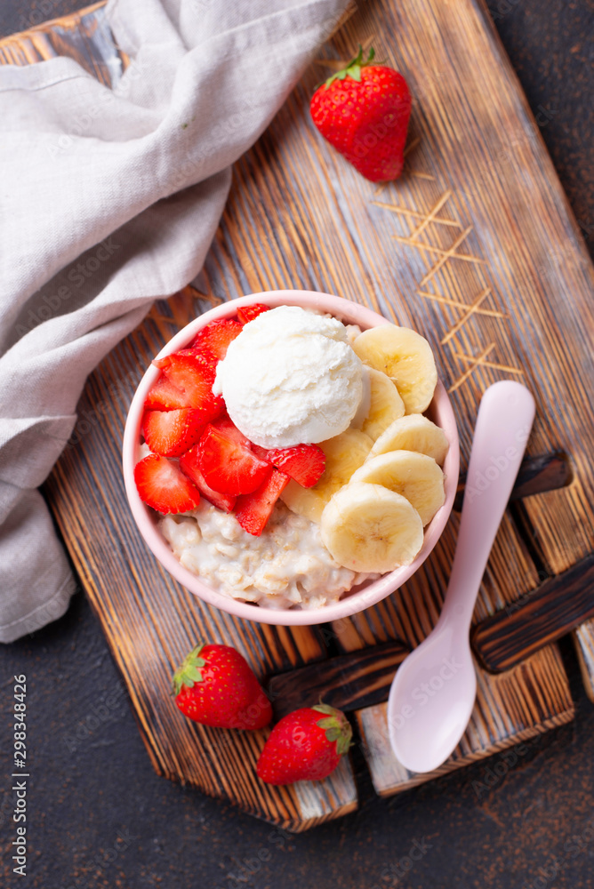 Oatmeal with strawberry, banana and ice cream