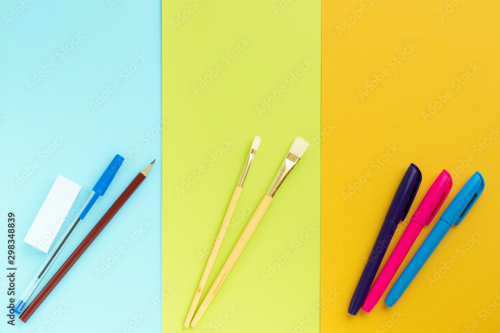 School Supplies And Coloring Pens Flat Lay On Yellow Background