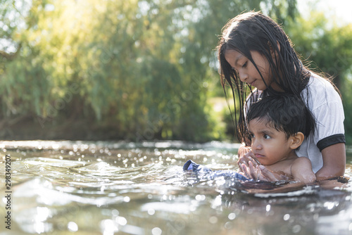 Boy and girl calm on the river