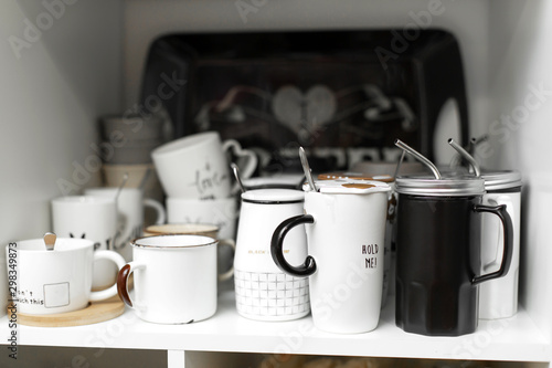 Dishes shop. Stylish mugs for drinks with a straw.