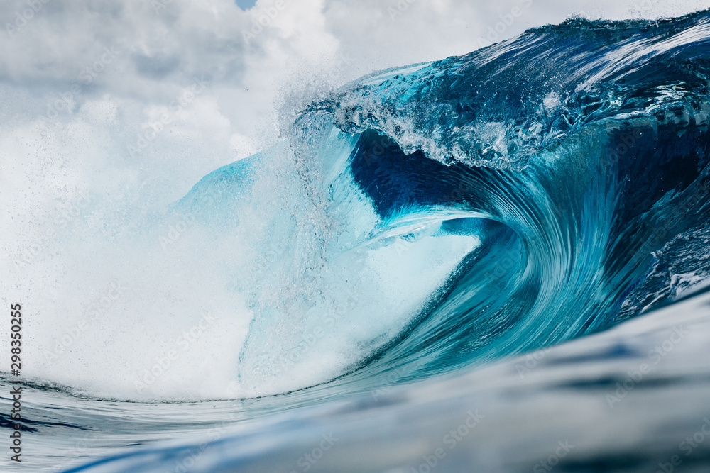 Clean and blue wave breaking in the ocean Clean and blue wave breaking in the ocean