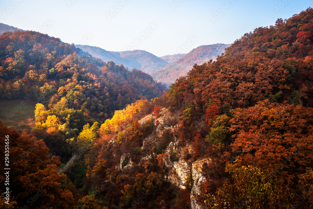 Autumn sunrise on mountain with fog between the hills. National park Djerdap in Serbia. Autumn sunrise on mountain with fog between the hills. National park Djerdap in Serbia.