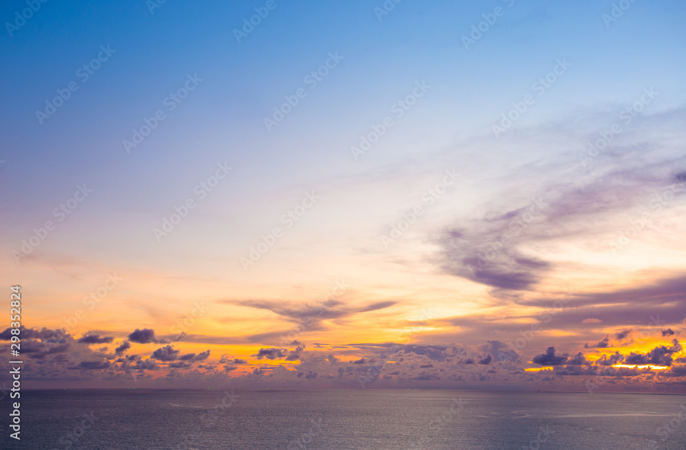 Beautiful of clouds and sky over sea with colorful horizon sky at sunset