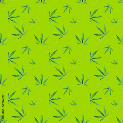 Seamless background with green hemp branch with five finger leaves  marijuana on soft mustard background  medical cannabis legalization. Modern style isometric concept.