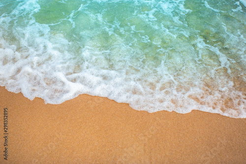 Soft wave of blue ocean selective focus on sandy beach ,On sandy beach background. Travel concept