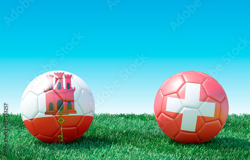 Two soccer balls in flags colors on green grass. Gibraltar and Switzerland. EURO 2020. Group D. 3d image