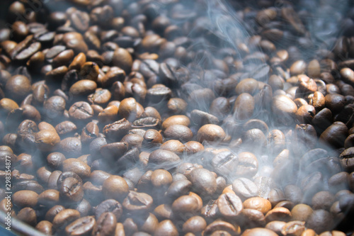 Coffee beans are roasted in a pan © Валерий Диденко