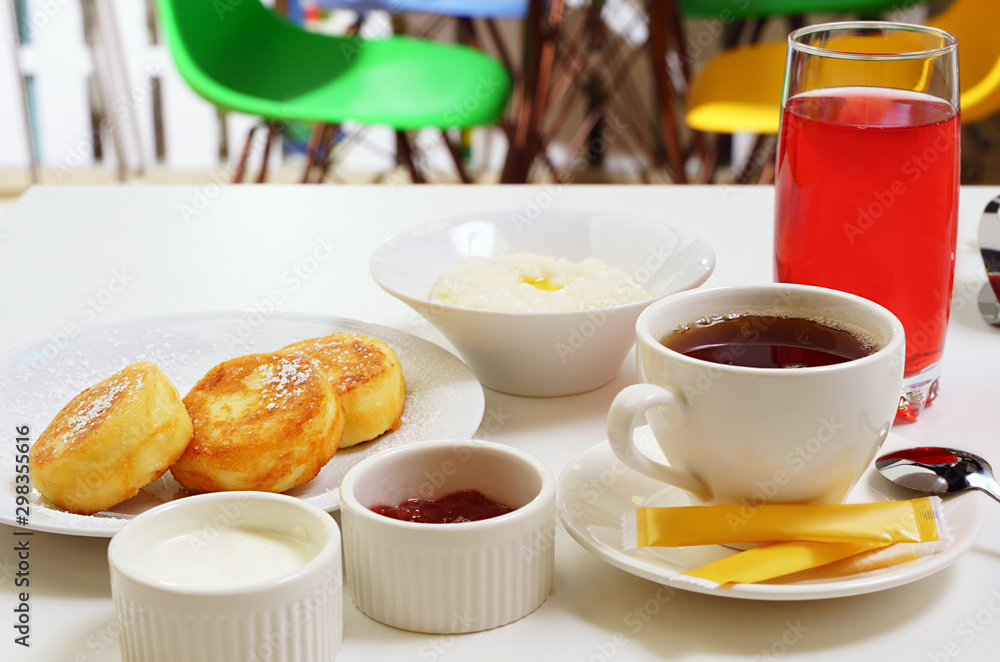 Set breakfast with porridge and cheesecakes Set breakfast with porridge and cheesecakes
