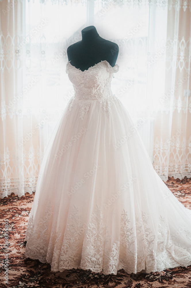 White wedding dress on the black dummy White wedding dress on the black dummy