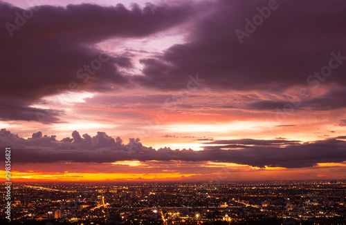Colorful of sky and cloud in sunset and twilight with cityscape in the evening