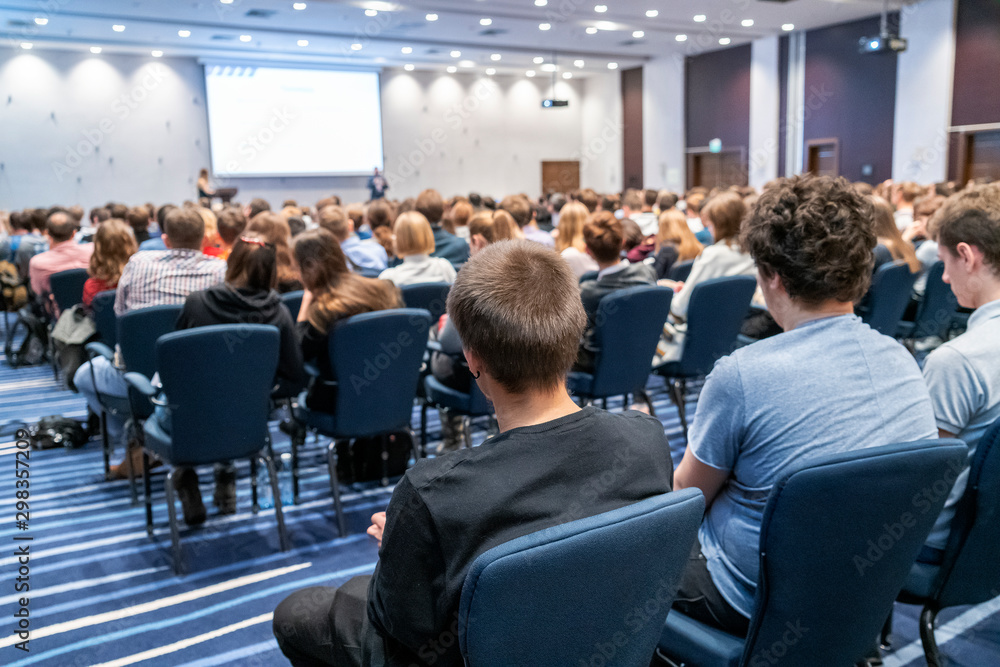 Image of a conference that takes place in a large conference room, workshop for young professionals, training in a large conference room, adult training - obrazy, fototapety, plakaty 