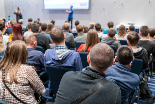 Image of a conference that takes place in a large conference room, workshop for young professionals, training in a large conference room, adult training © borisblik
