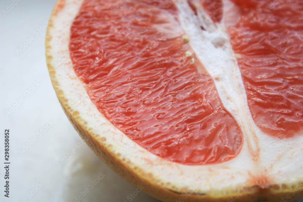 Sliced grapefruits on a stone table Sliced grapefruits on a stone table