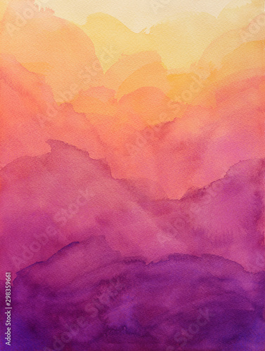 beautiful hues of yellow gold pink and purple in hand painted watercolor background design with paint bleed and fringing in colorful sunrise or sunset colors in cloudy shapes