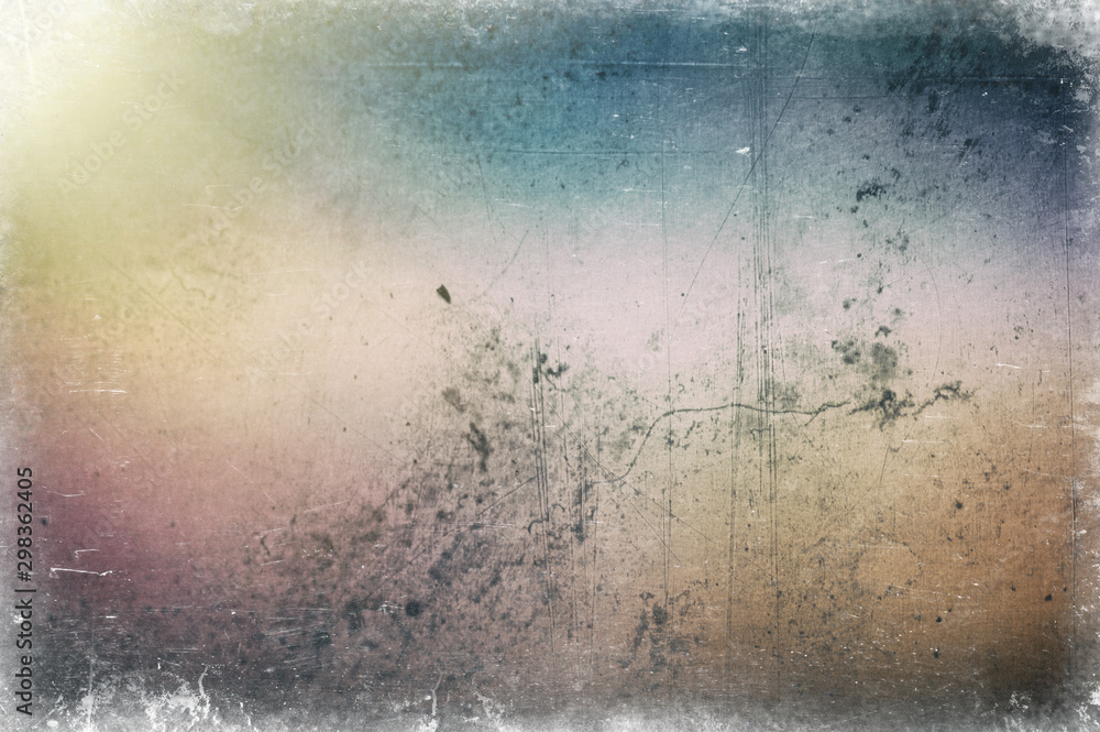 Obraz premium Abstract blurred background of mixed color color. Scratched stained and damaged surface.