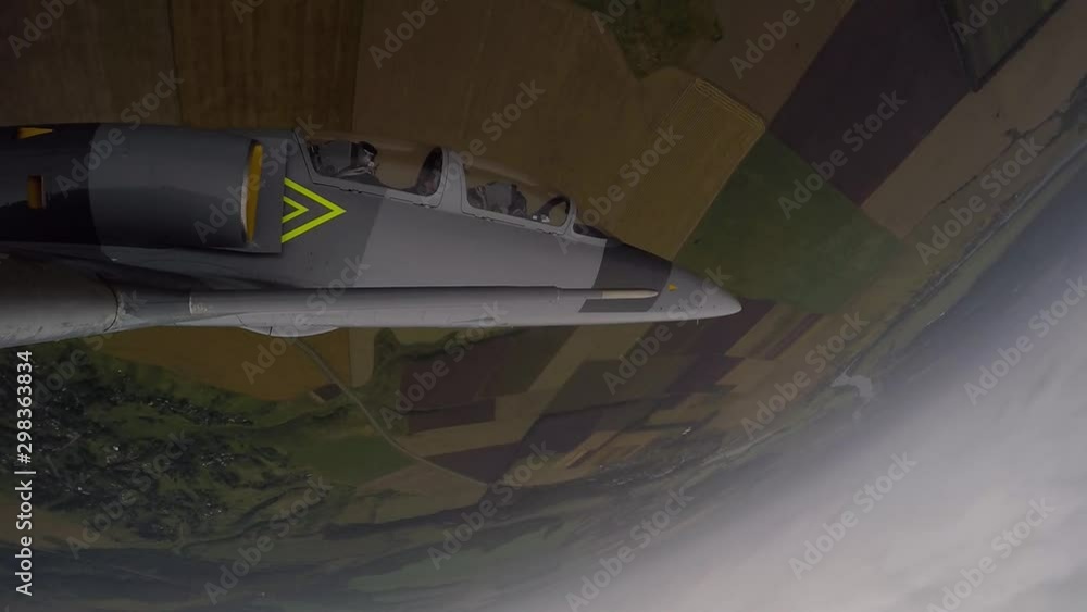 Gray blue combat fighter plane make double barrel roll maneuver against ...