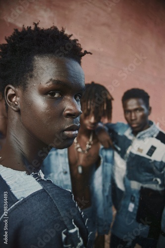 Selective focus of three men wearing denim shirts