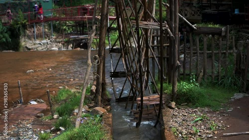 Famous Cat Cat Waterwheels in Northern Vietnam spinning in the river on a hot day in Autumn