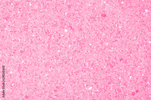 Holographic bright light pink glitter real texture background.