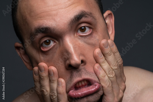 Photos Photo of grimacing man, close up shooting