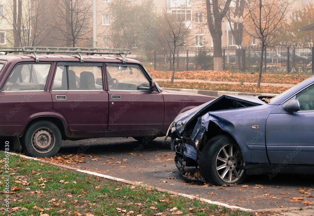 Mangled car after an accident in the Parking lot Mangled car after an accident in the Parking lot