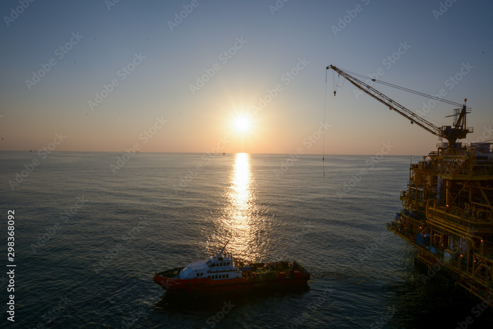 Offshore petroleum industry, beautiful sunset 