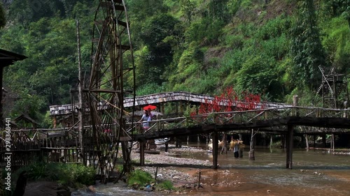 Famous Cat Cat Waterwheels in Northern Vietnam spinning in the river on a hot day in Autumn