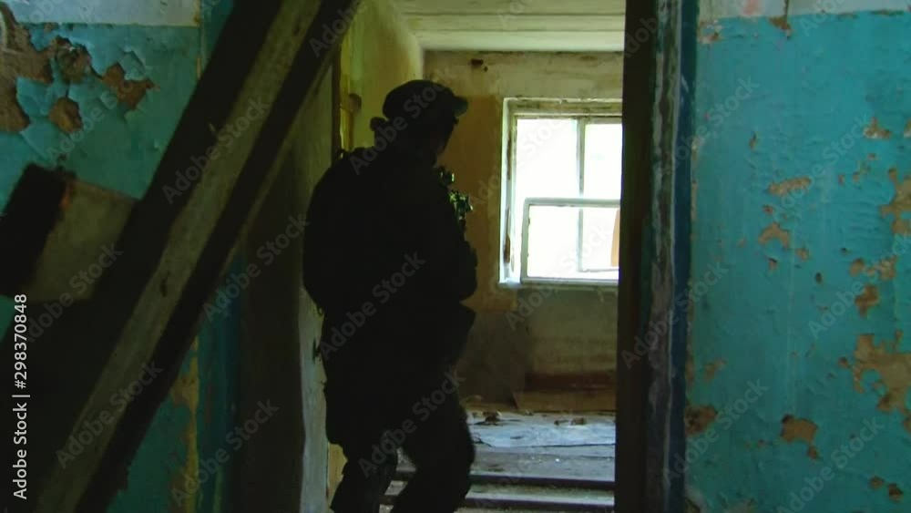 Players of airsoft in military uniform with a weapon on background of forest. Sports game using a copy of a firearm. Players of airsoft in military uniform with a weapon on background of forest. Sports game using a copy of a firearm.