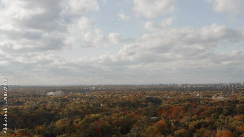 Aerial shot of suburban Toronto neighbourhood during peak fall colors. Cinematic 4K footage. Aerial shot of suburban Toronto neighbourhood during peak fall colors. Cinematic 4K footage.